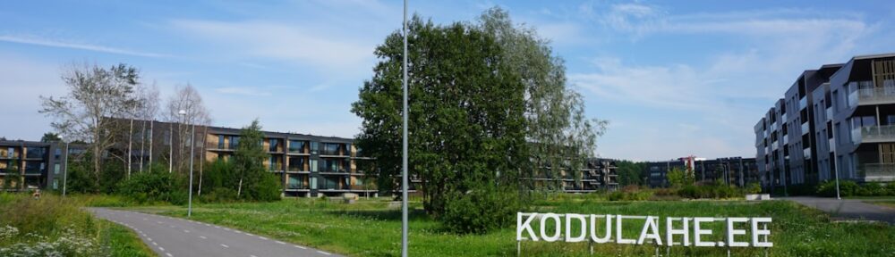 Modern apartment buildings with kodulahe.ee sign
