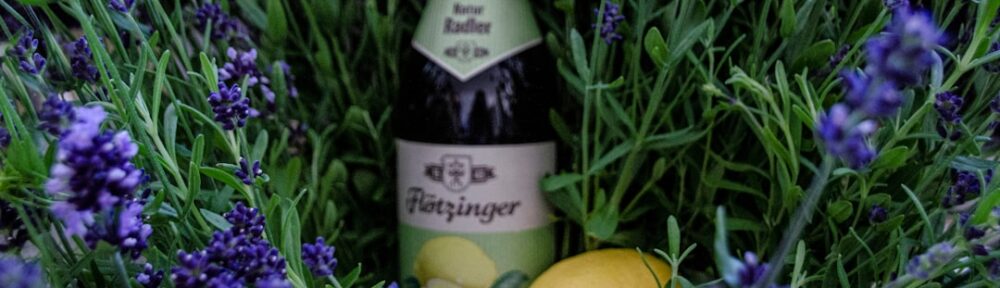 yellow lemon beside purple flowers